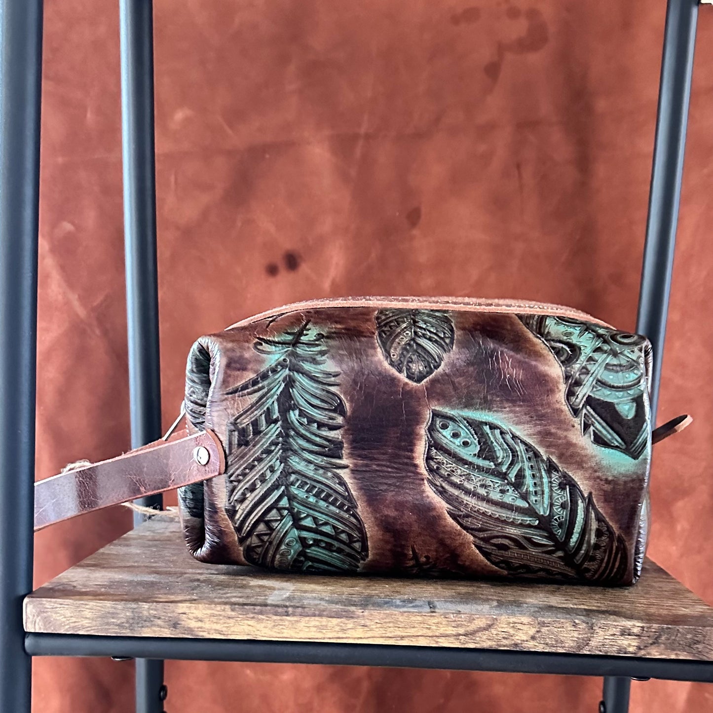 Feather embossed toiletry bag